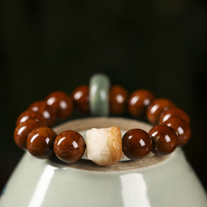 Braccialetto della saggezza del leone danzante dei semi di Bodhi viola Buddha Stones