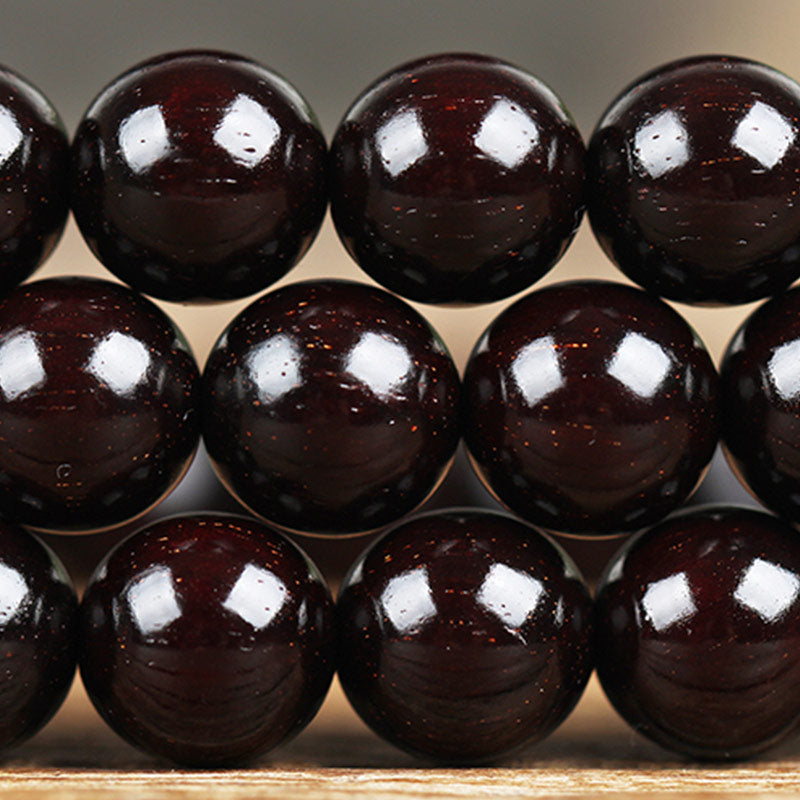 Braccialetto di protezione con nodo cinese in legno di sandalo rosso con piccola foglia e stella d'oro Buddha Stones