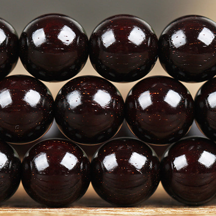 Braccialetto di protezione con nodo cinese in legno di sandalo rosso con piccola foglia e stella d'oro Buddha Stones