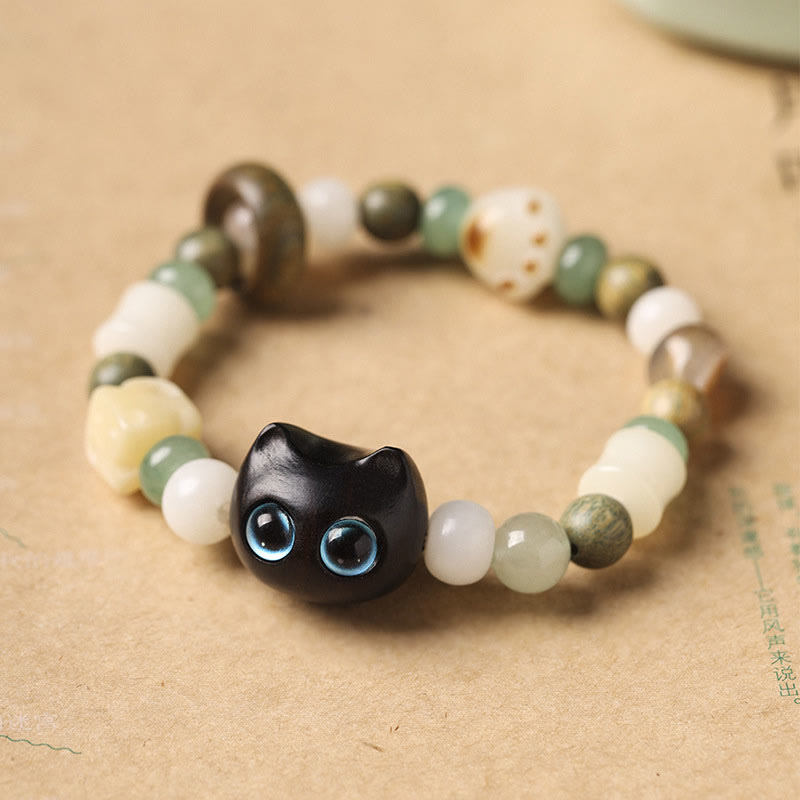 Buddha Stones Semi di Bodhi Sandalo verde Legno di ebano Foglia piccola Sandalo rosso Testa di gatto Zampa Artiglio Bracciale della pace - Gatto in legno di ebano (occhi azzurri) (circonferenza polso 14-16 cm) - image 1