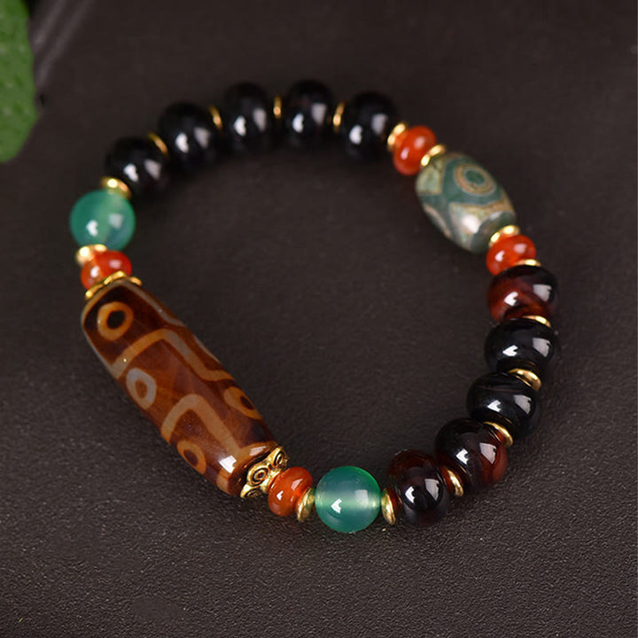 Buddha Stones Braccialetto di protezione con perline Dzi a tre occhi, perline Dzi a nove occhi naturali tibetane