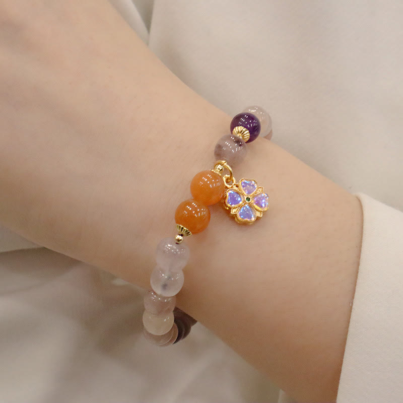 Braccialetto di perline con ciondolo a forma di fiore viola dorato naturale di seta Buddha Stones