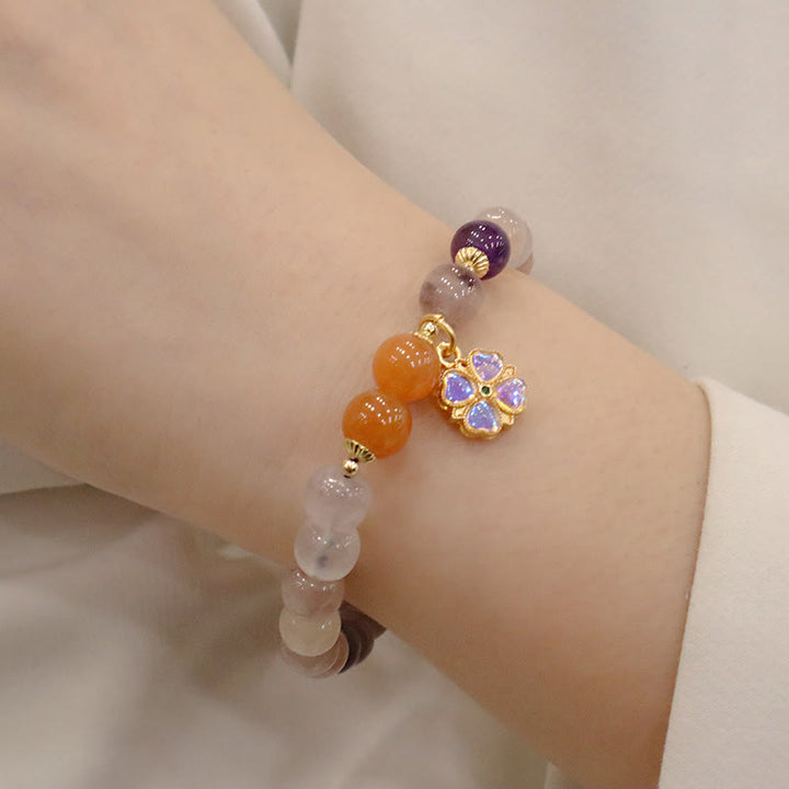 Braccialetto di perline con ciondolo a forma di fiore viola dorato naturale di seta Buddha Stones