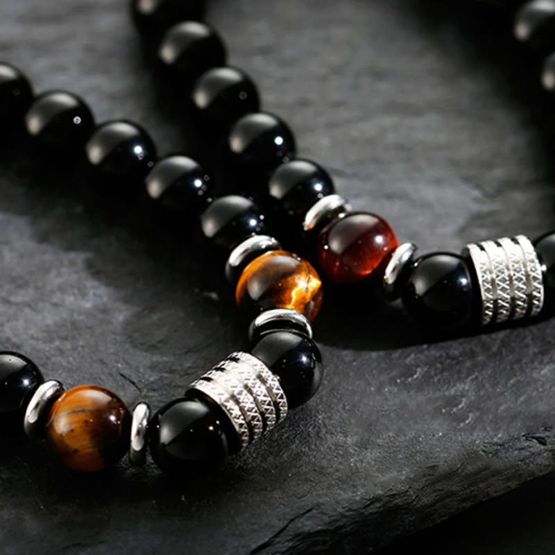 Bracciale Buddha Stones in ossidiana nera naturale con occhio di tigre e forza