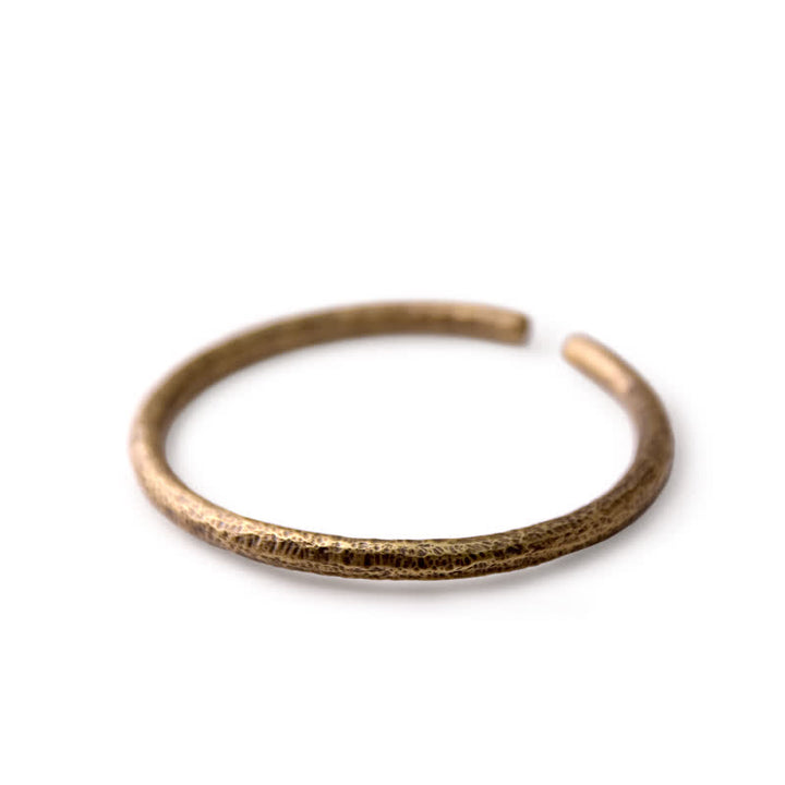 Bracciale regolabile con polsino in rame e design rustico Buddha Stones