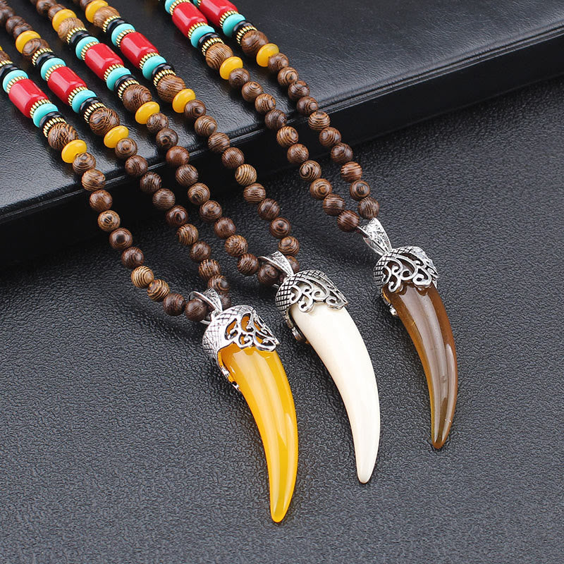 Collana con ciondolo in stile corno in pietra turchese e legno wenge, protezione e meditazione