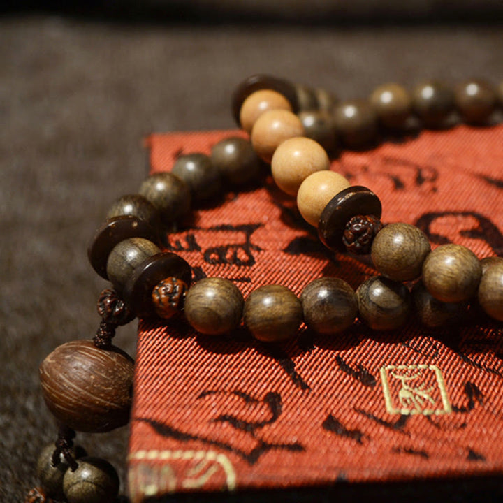 Bracciale Mala con ciondolo di protezione in legno di sandalo tibetano Buddha Stones