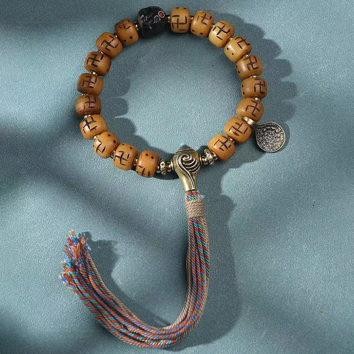 Buddha Stones naturale tibetano osso di cammello svastica Dzi perlina Shankha Buddha fascino Kirtimukha braccialetto con nappa protezione fortuna