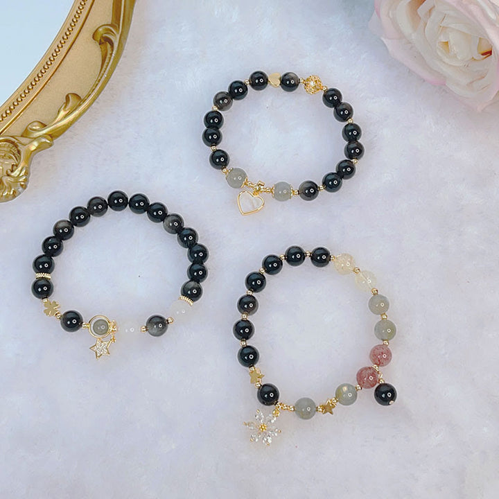 Braccialetto di protezione con cuore, stella e fiore in ossidiana naturale con Buddha Stones argento lucido