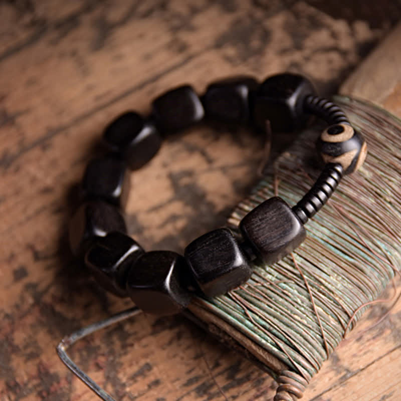 Braccialetto di forza con perline di legno di ebano tibetano Dzi Buddha Stones