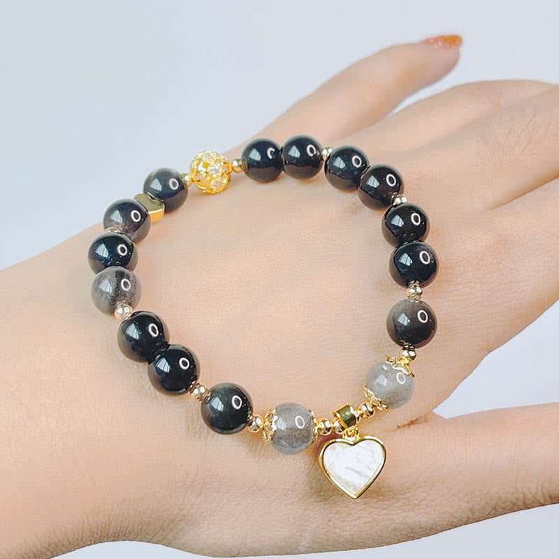 Braccialetto di protezione con cuore, stella e fiore in ossidiana naturale con Buddha Stones argento lucido