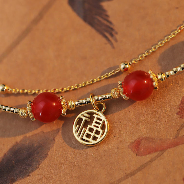 Braccialetto di accettazione di sé con ciondolo a forma di carattere Fu in agata rossa Buddha Stones