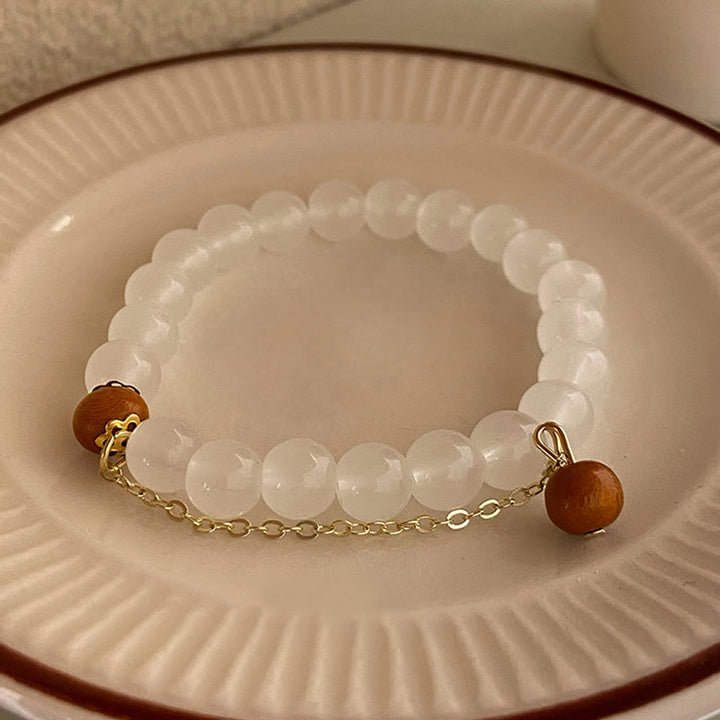 Braccialetto di protezione con ciondolo a forma di carattere Fu con occhio di gatto Buddha Stones in legno di sandalo