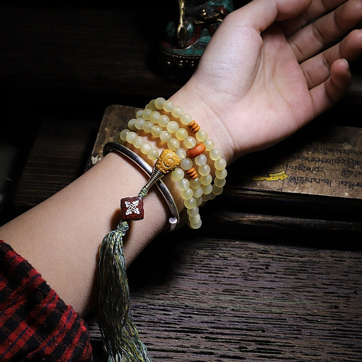 Braccialetto della fortuna in ambra e corno di pecora del Tibet con 108 perle di Mala Buddha Stones