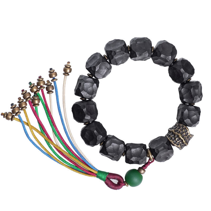 Bracciale Mala da polso con nappa in legno di Buddha Stones tibetano e rame della pace