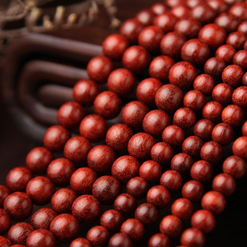 Braccialetto di meditazione Mala con 108 perle di legno di sandalo rosso e foglie piccole tibetane Buddha Stones