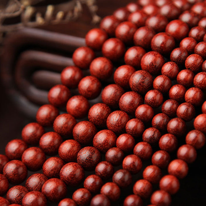 Braccialetto di meditazione Mala con 108 perle di legno di sandalo rosso e foglie piccole tibetane Buddha Stones