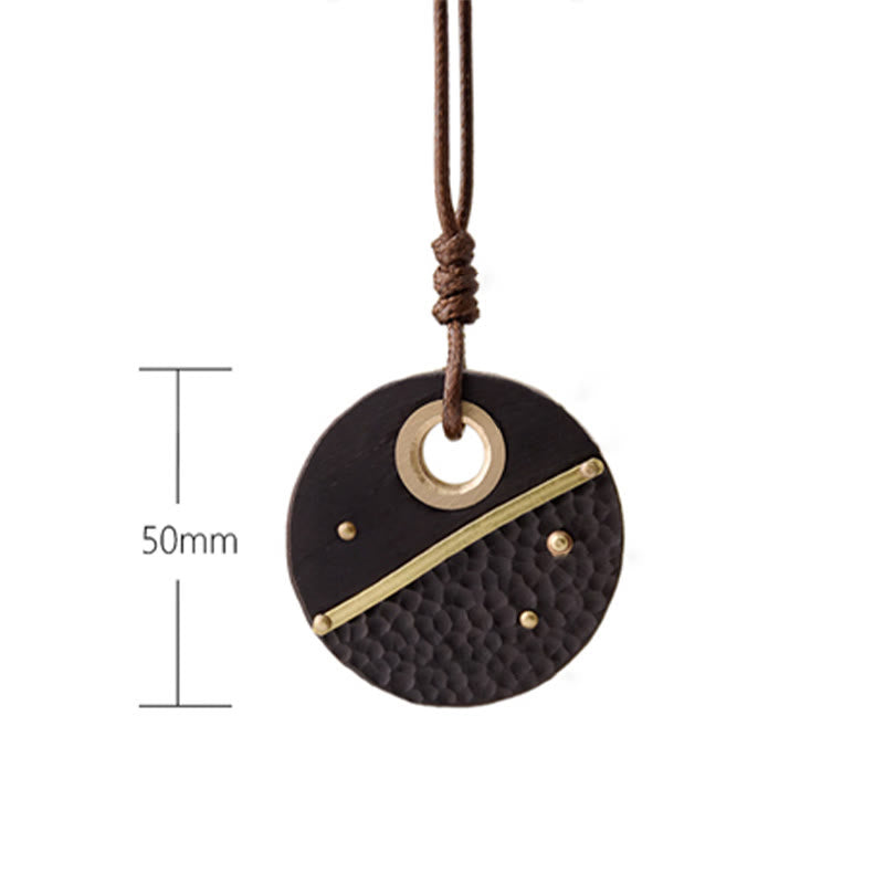 Collana con ciondolo in legno di ebano e rame, realizzata a mano , Buddha Stones, simbolo della pace