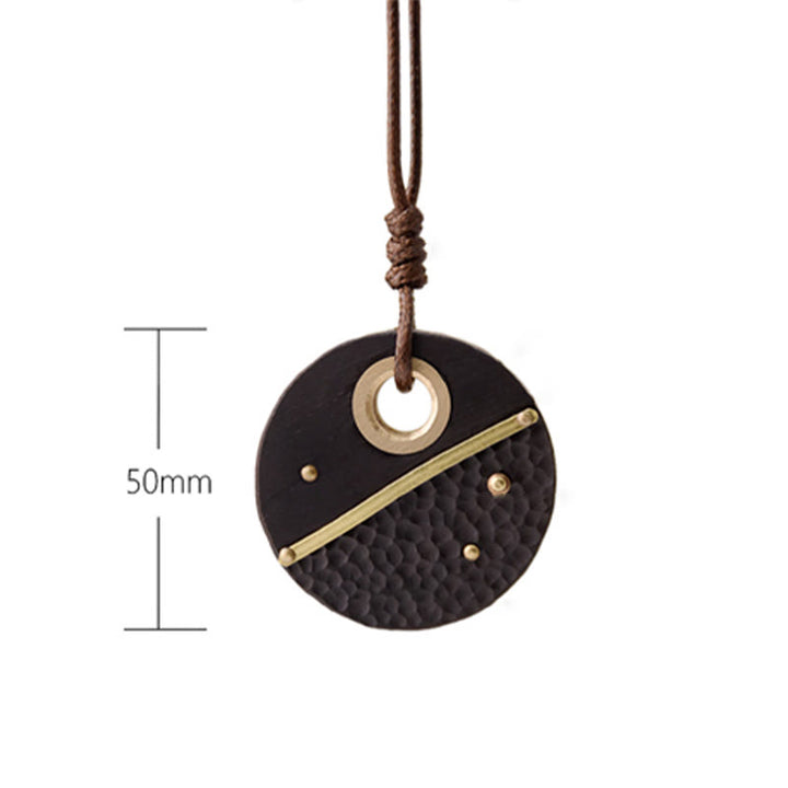 Collana con ciondolo in legno di ebano e rame, realizzata a mano , Buddha Stones, simbolo della pace