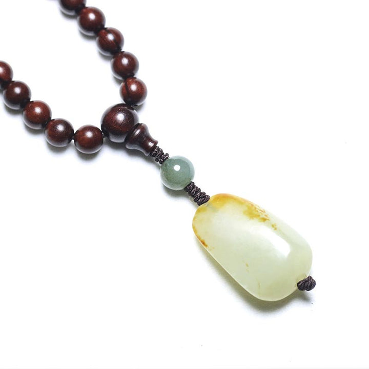 Braccialetto di meditazione Mala in giada di sandalo rosso con piccole foglie tibetane di Buddha Stones