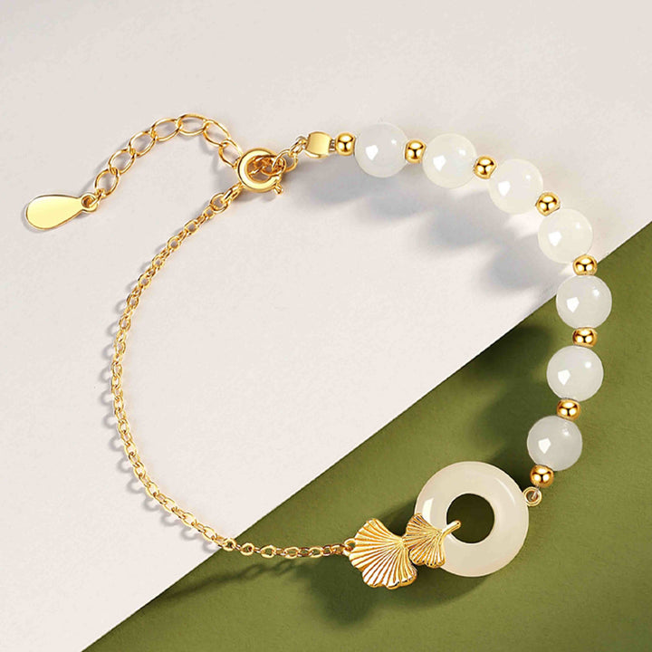 Braccialetto della fortuna con foglia di ginkgo e fibbia della pace in argento sterling 925 con Buddha Stones e giada bianca Hetian