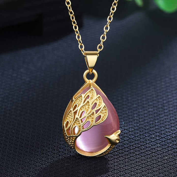 Collana pendente con ciondolo in cristallo rosa, calcedonio verde, pavone, rame, amore lenitivo