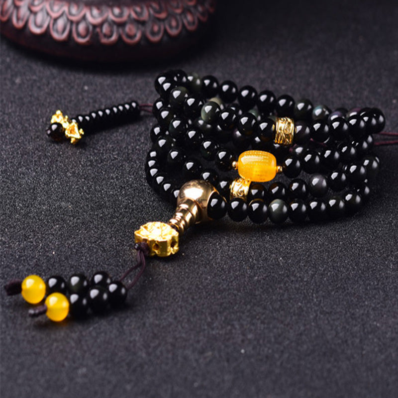 Braccialetto Mala Buddha Stones 108 perle in ossidiana nera naturale Lotus Fulfilment