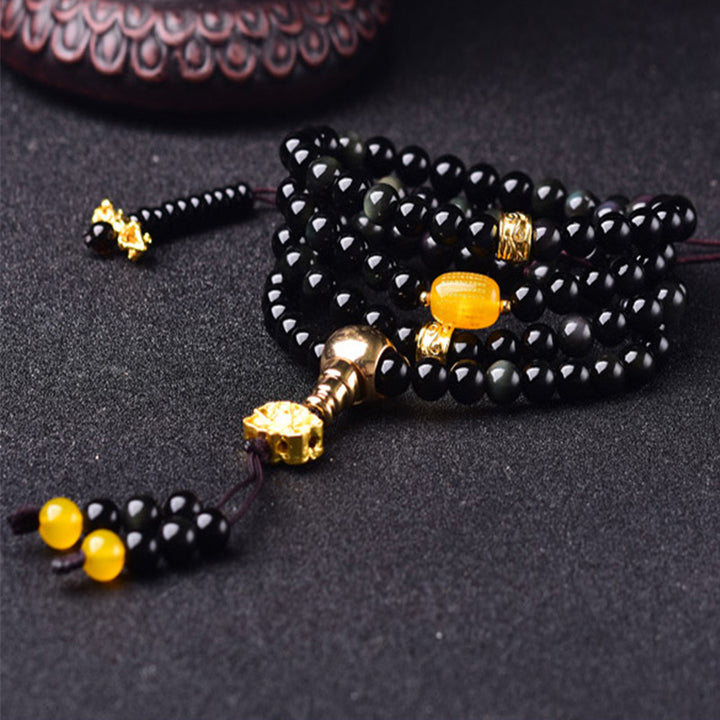 Braccialetto Mala Buddha Stones 108 perle in ossidiana nera naturale Lotus Fulfilment