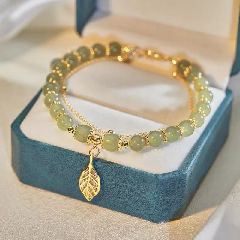 Braccialetto di perline con carattere Fu , Buddha Stones di giada, foglia di ginkgo, tulipano, arachidi e fortuna - Foglia d'oro e giada - image 0
