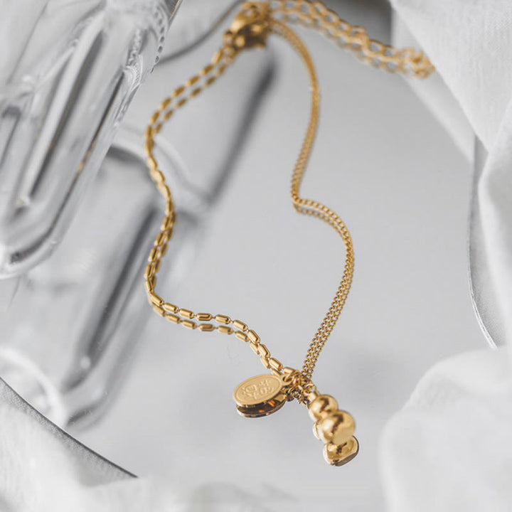 Cavigliera con fibbia della ricchezza e design a zucca portafortuna in oro 18k Buddha Stones