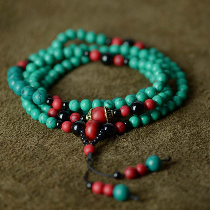 Braccialetto di protezione con perline di turchese rosso e onice nero Buddha Stones