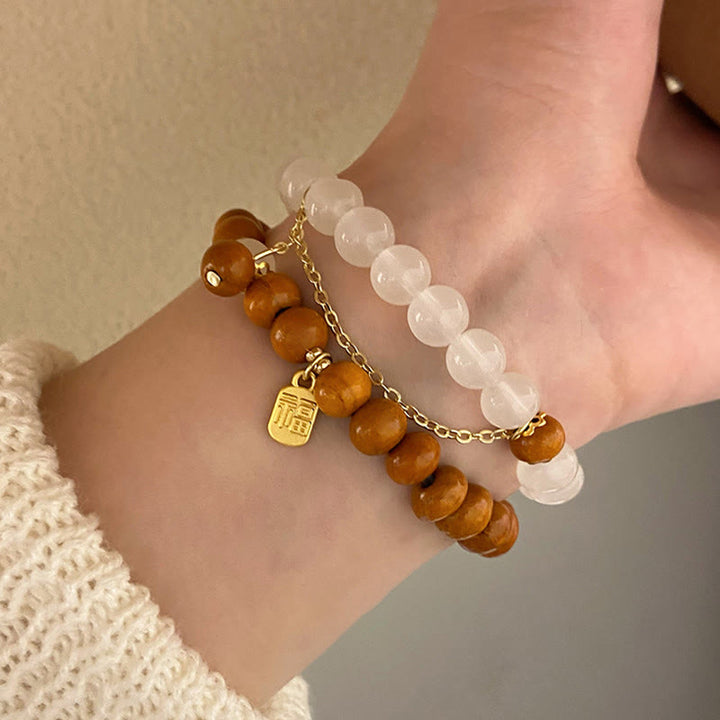 Braccialetto di protezione con ciondolo a forma di carattere Fu con occhio di gatto Buddha Stones in legno di sandalo