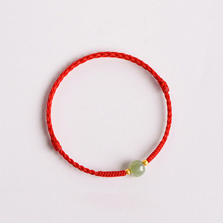 Bracciale intrecciato con Buddha Stones e portafortuna