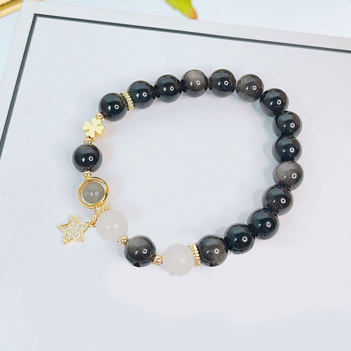 Braccialetto di protezione con cuore, stella e fiore in ossidiana naturale con Buddha Stones argento lucido