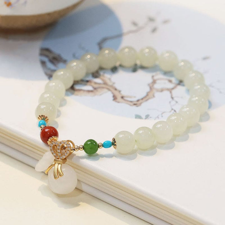 Braccialetto di benedizione con sacco di soldi placcato oro 14K in giada bianca naturale di Hetian Buddha Stones