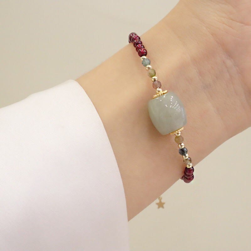 Braccialetto di protezione con fibbia della pace in perline di giada granata Buddha Stones