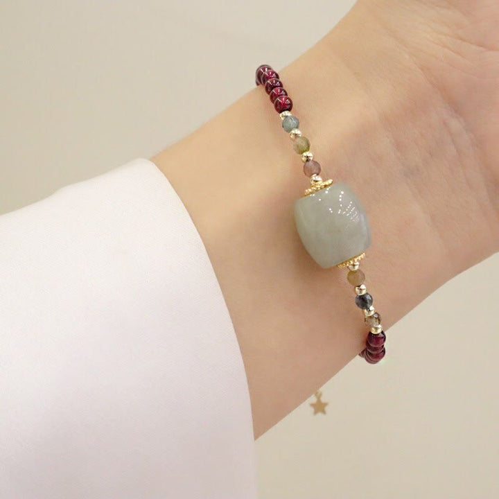 Braccialetto di protezione con fibbia della pace in perline di giada granata Buddha Stones