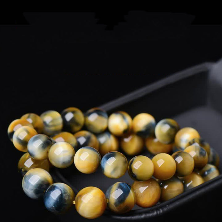 Braccialetto di protezione e forza con occhio di tigre Buddha Stones