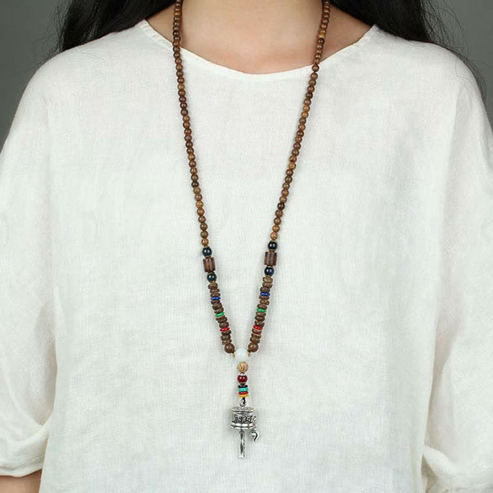 Buddha Stones Tibetano Om Mani Padme Hum Ruota della Preghiera Rotazione Vajra Collana Pendente in Legno - image 15