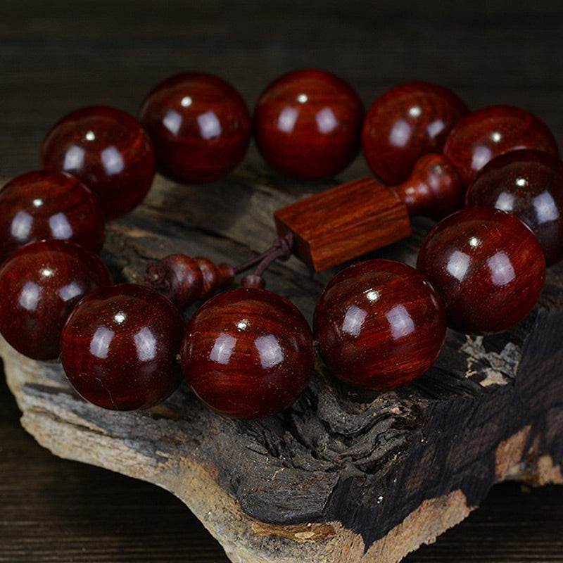 Braccialetto di rilassamento in legno di sandalo rosso con foglie piccole tibetane Buddha Stones