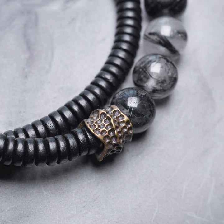 Braccialetto di coppia della saggezza del rame del legno di ebano del quarzo rutilato nero Buddha Stones