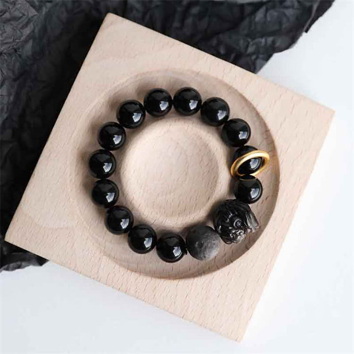 Bracciale in ossidiana nera, argento lucido e forza del leone