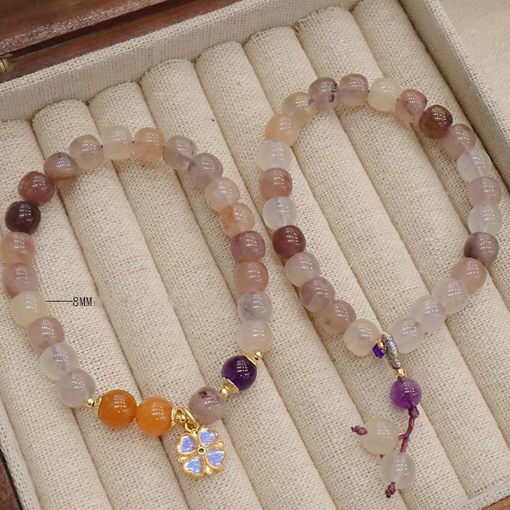 Braccialetto di perline con ciondolo a forma di fiore viola dorato naturale di seta Buddha Stones