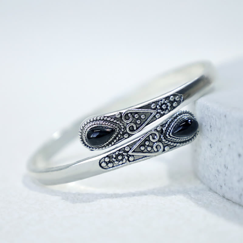 Braccialetto con polsino curativo con motivo a goccia d'acqua in zircone Buddha Stones