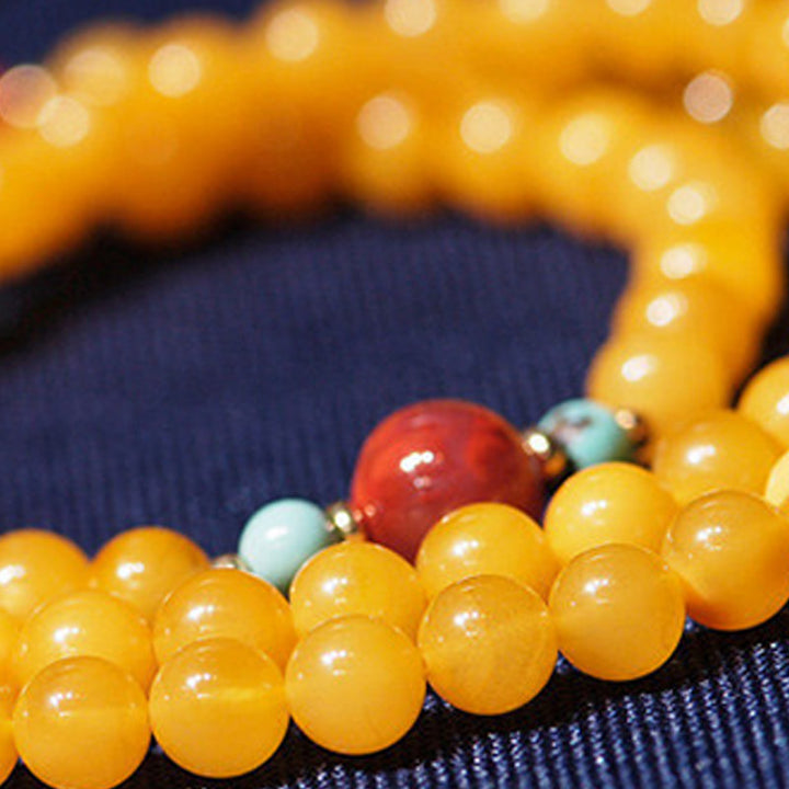 Collana con ciondolo a forma di fiore in ambra curativa e bilanciata