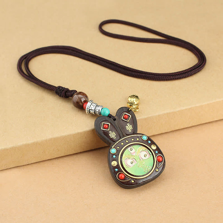 Collana pendente Thangka con cinque divinità della ricchezza in ebano tibetano