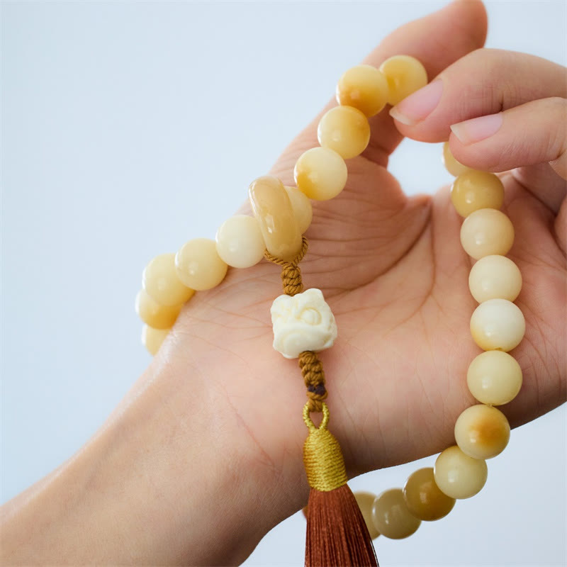 Buddha Stones Semi di Bodhi naturali Avorio Frutta Leone danzante Ciondolo Armonia Nappa Polso Mala