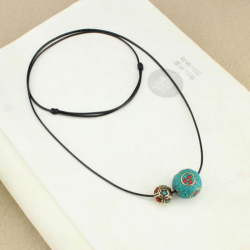 Collana con ciondolo con doppia perla turchese tibetana Buddha Stones, protezione e forza
