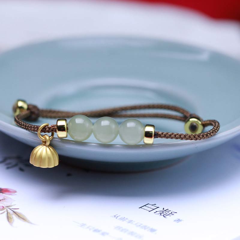 Braccialetto intrecciato con corda rossa in semi di loto di giada naturale Buddha Stones