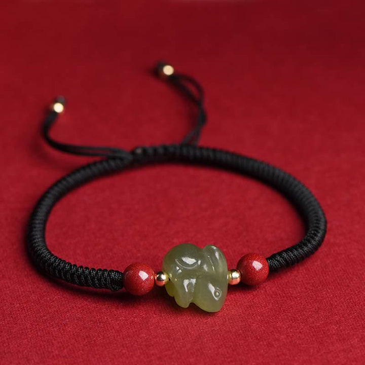 Braccialetto di corda dell'abbondanza di perline di cinabro con coniglietto di giada di Hetian dell'anno del coniglio